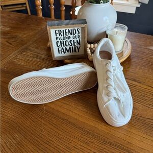 Maurice’s white sneakers